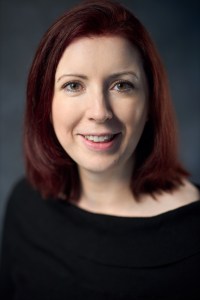 Author photo in black sweater
